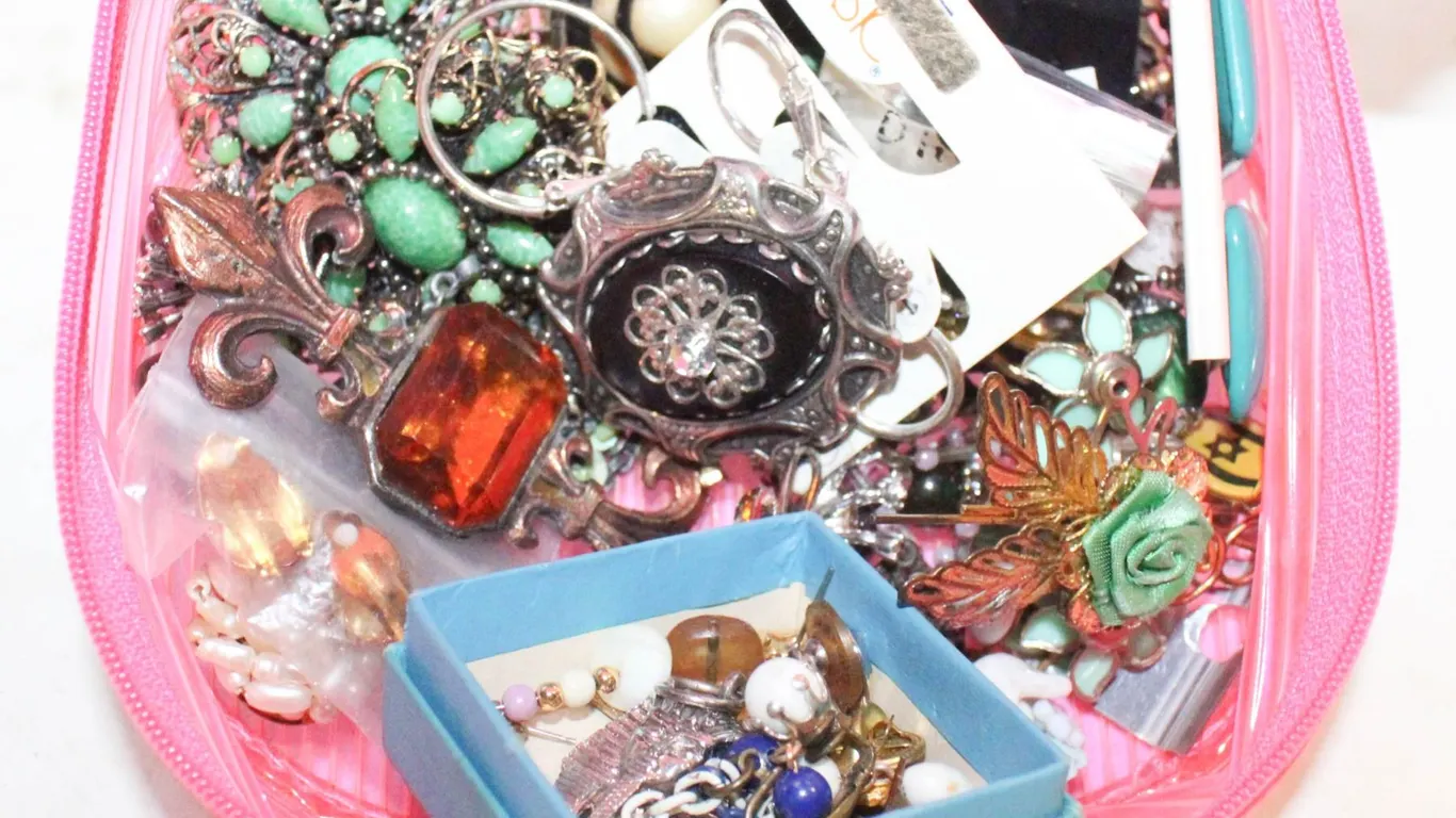 PINK CASE OF VINTAGE JEWELLERY