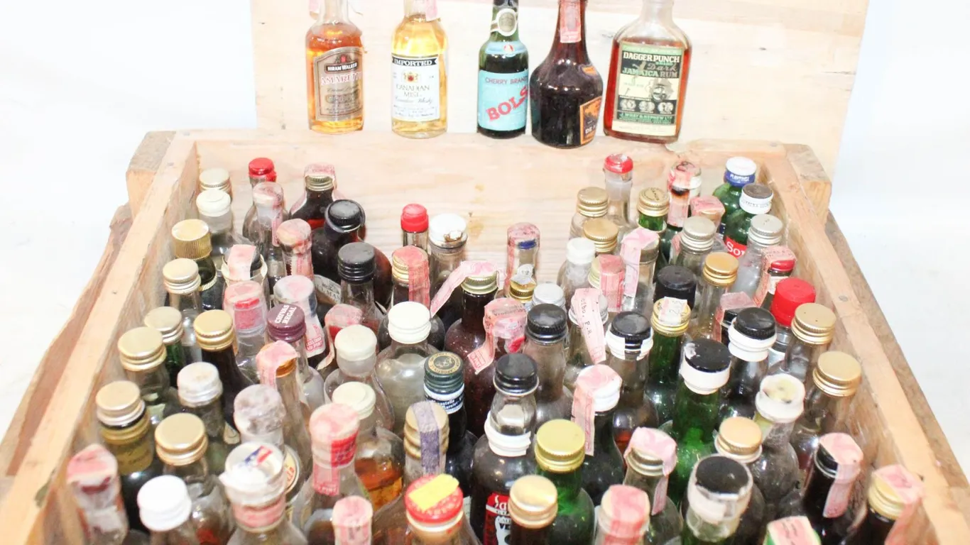 CRATE OF VINTAGE LIQUOR BOTTLES