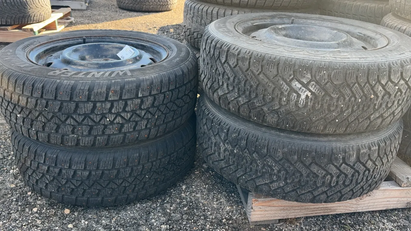 Set of 4 Winter Tires on Steel Rims - (2) Goodyear Nordic 205/60R16 & (2) Artic Claw Studded 205/60R