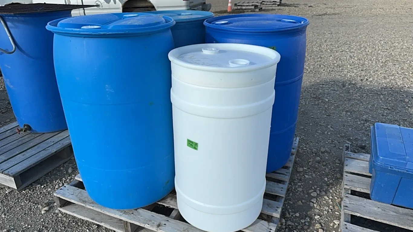 45 Gallon Blue Barrels (x3) and Small White Barrel, Marked 35 (P10-R7-W-S1955)