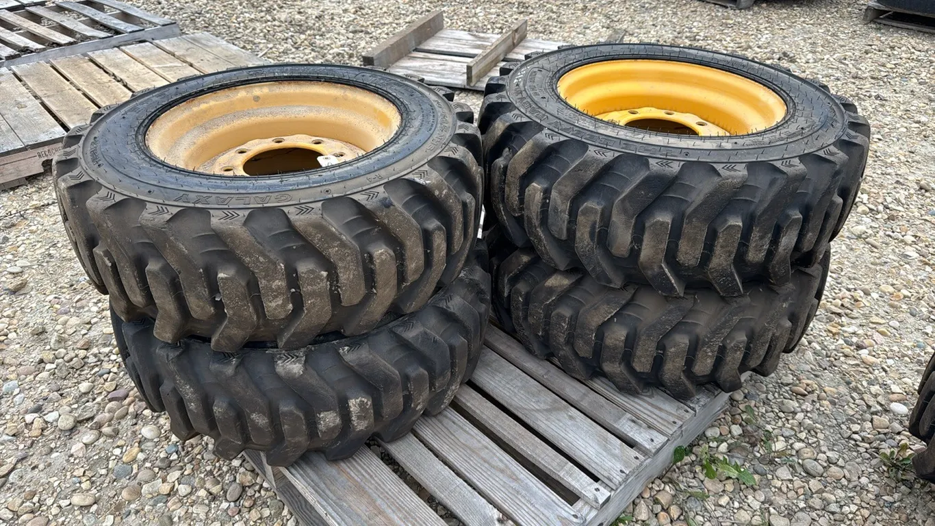 4 Qty John Deere Skid Steer 250 Tires 10-16.5 & Rims, Marked A (P10-R10-E-S392)