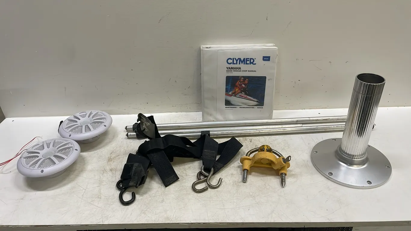 3 Boat Cover Prop Up Rods, 2 Rear Trailer Tie Down Straps, 2 Boss Marine MR6W Speakers, Trailer Tong Lock, Boat Trim Cylinder Ram Lock, Extended Seat
