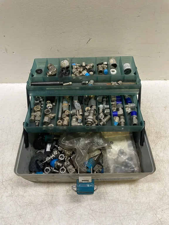 Container of Assorted Brass and Other Fittings, Marked 104 (P3-R1T2-S11)