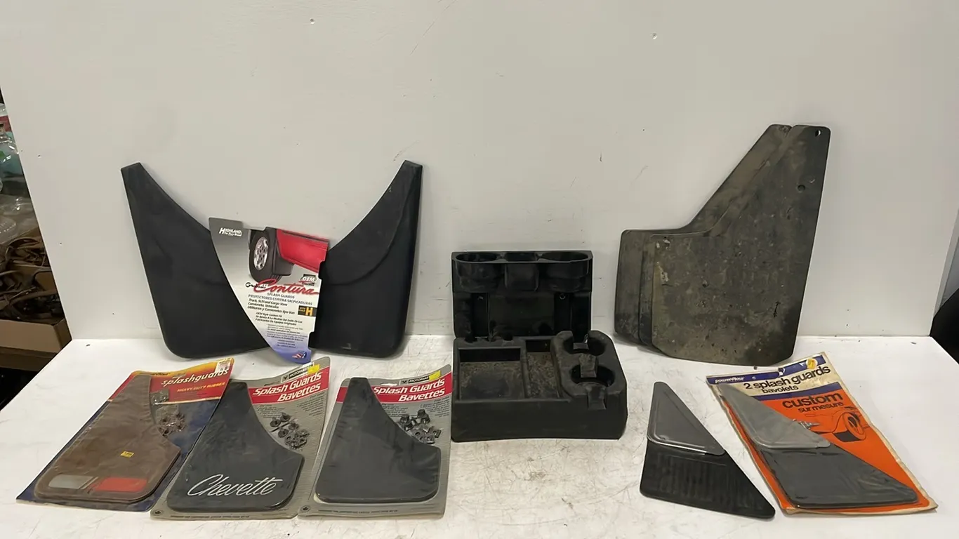 2 Cup Holders Plus 8 Sets of Mud Flaps, Seller States That Some Are New, Item #13 (P3-R1T8-S2107)