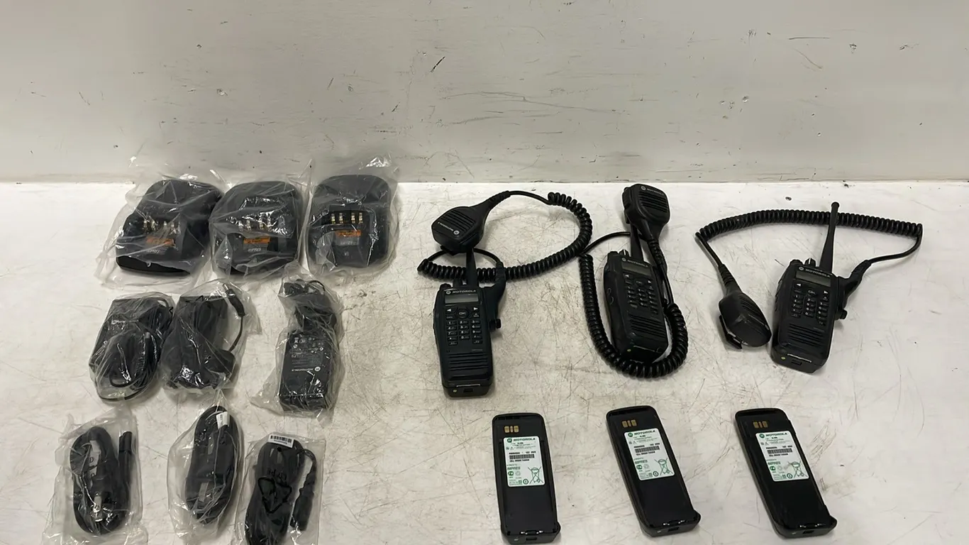 3 Handheld Radios Including 6 Batteries and 3 Chargers, Able To Be Reprogrammed, Seller States That they Are In Good Working Order and The Chargers Ar