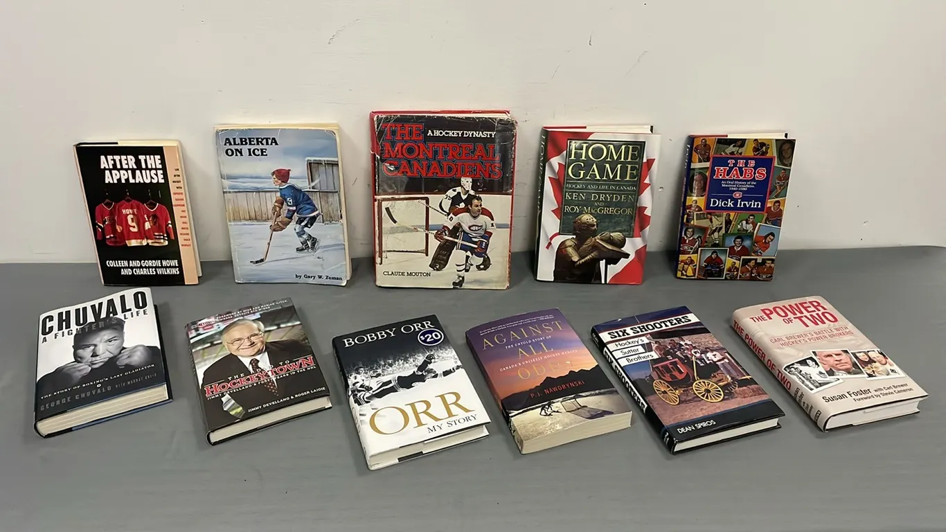 Assortment of Hockey Books and One Boxing Book (P4-NWS15-S1085)