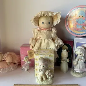 Precious Moments Standing Doll in Ruffled Dress and Sleeping Baby Doll on Heart Pillow, and More