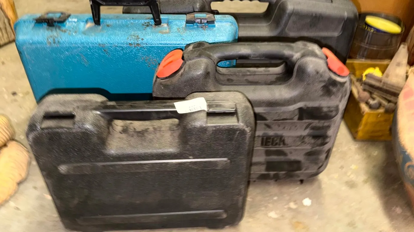 Four Hard Plastic Tool Cases: Black and Decker, Makita, and Craftsman Professional