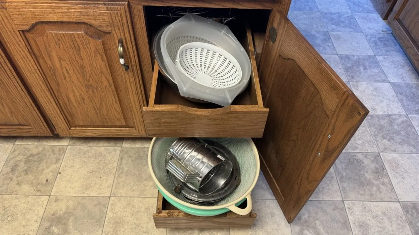 Assorted Kitchenware: Baking Dishes, Mixing Bowl, Colanders, Flour Sifter, and Wire Racks