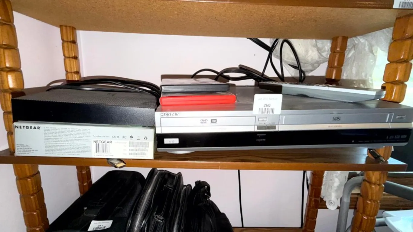 Sony DVD and VHS Recorder RDR-VX530, Samsung Blu-ray Player BD-JM57, Netgear Wireless Router WNR1000, Two DVDs