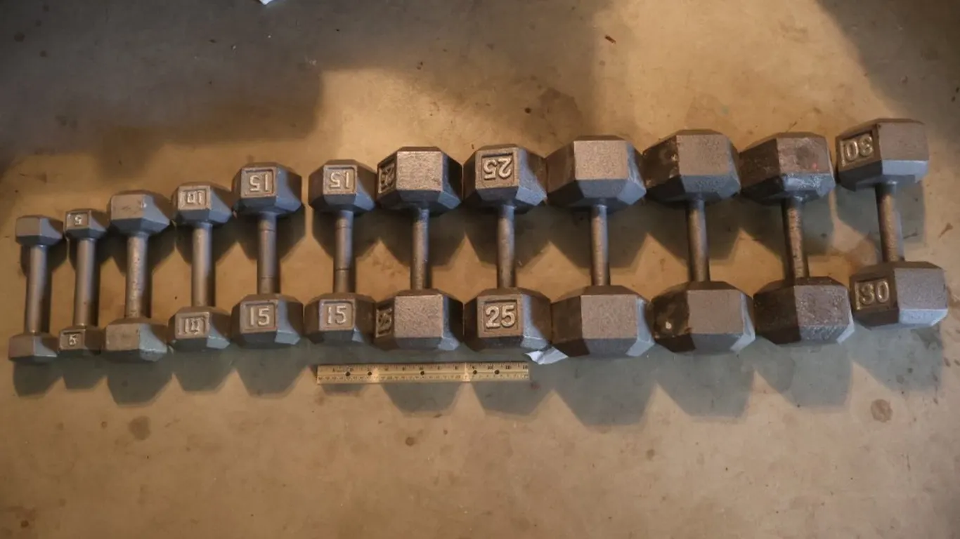 Twelve Cast Iron Hex Dumbbells, Graduated Sizes 5 to 30