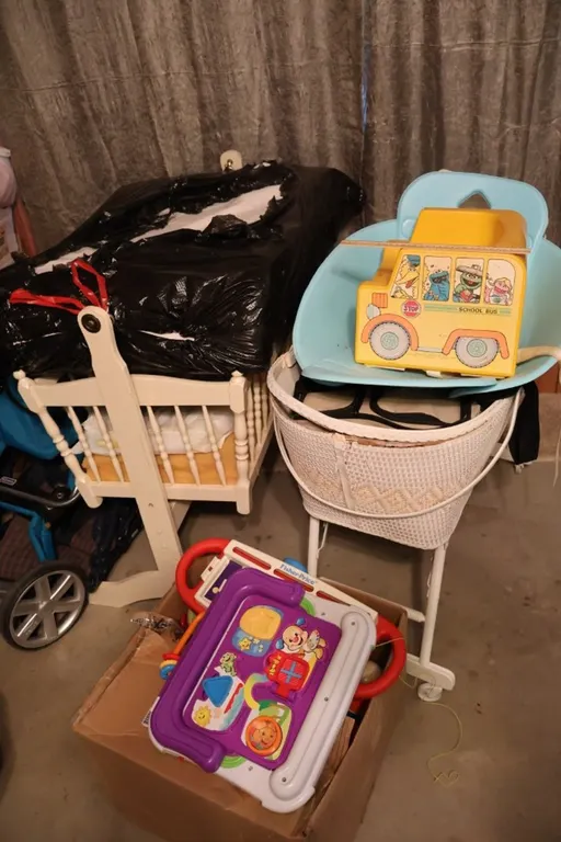 Wooden Rocking Cradle, Woven Bassinet, Toddler Booster Seat, and Assorted Toys and Accessories