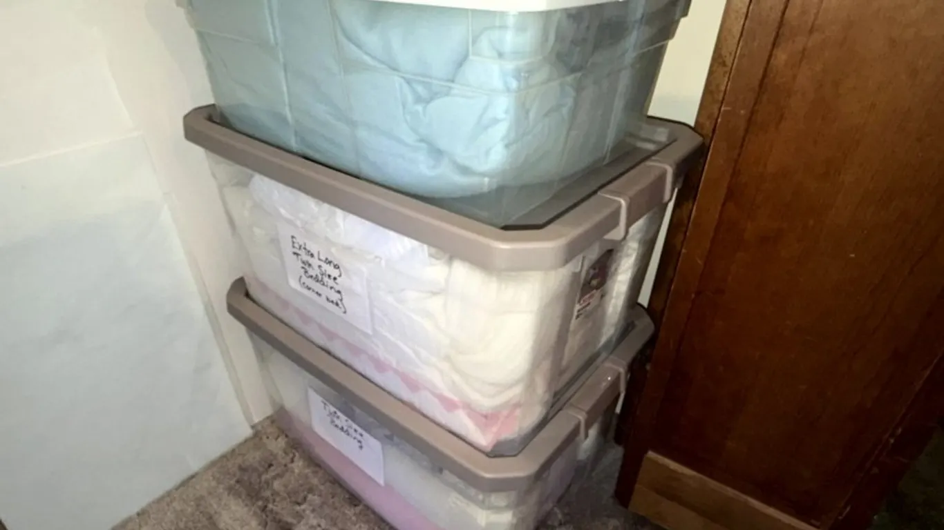 Assorted Bedding, Blankets, and Quilts in Three Plastic Storage Containers
