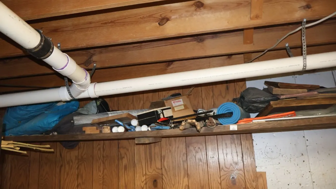 Assorted Shelf Contents: Wooden Picture Frames, Blue Poly Tarp, Foam Pad, Rope, and Hardware