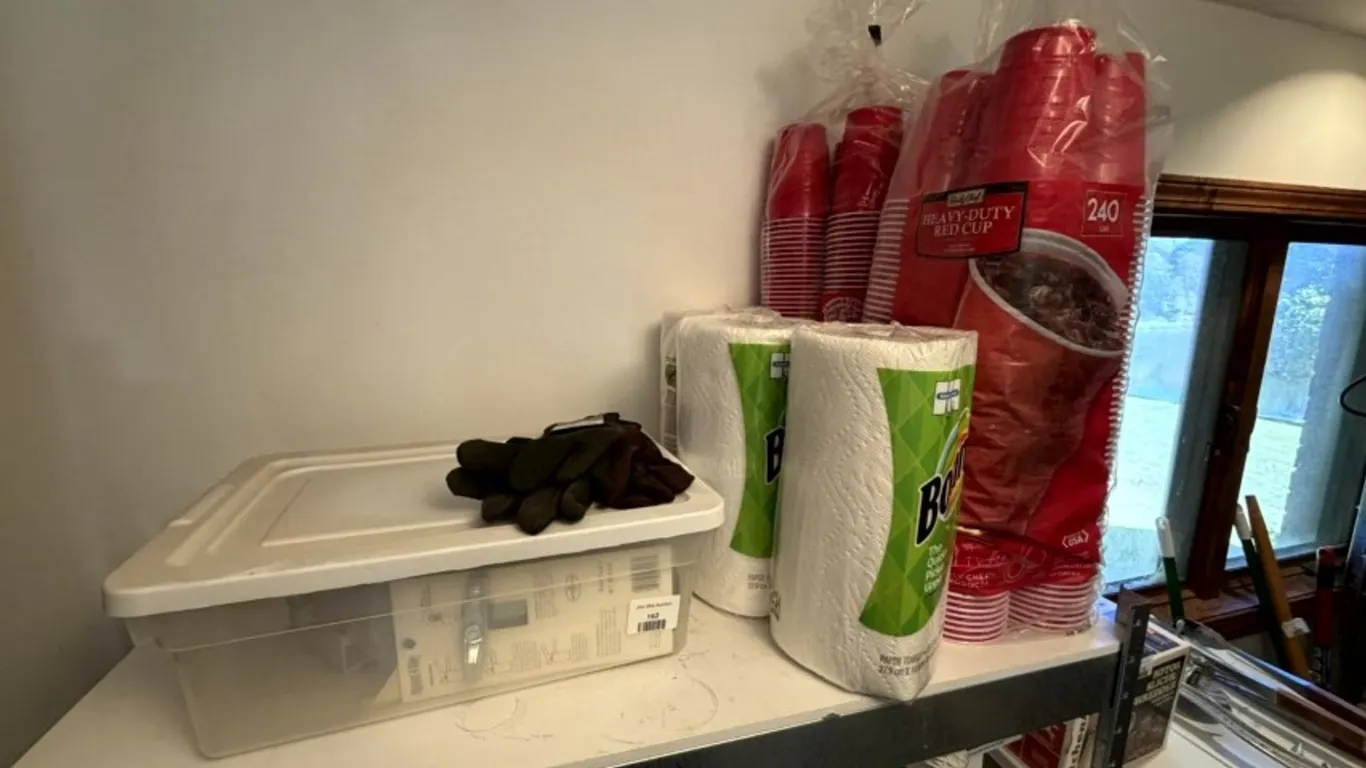 Assorted Household Supplies, Paper Towels, Red Plastic Cups, Matches, and Work Gloves