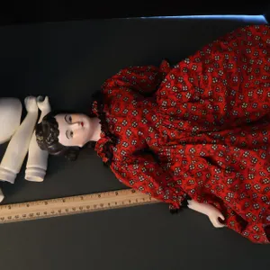 China Head Doll in Red Floral Dress and Porcelain Doll Parts