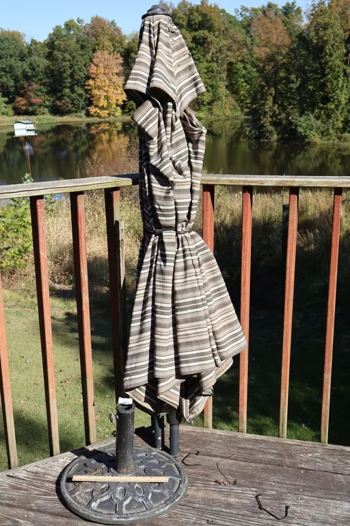 Striped Patio Umbrella and Cast Metal Base