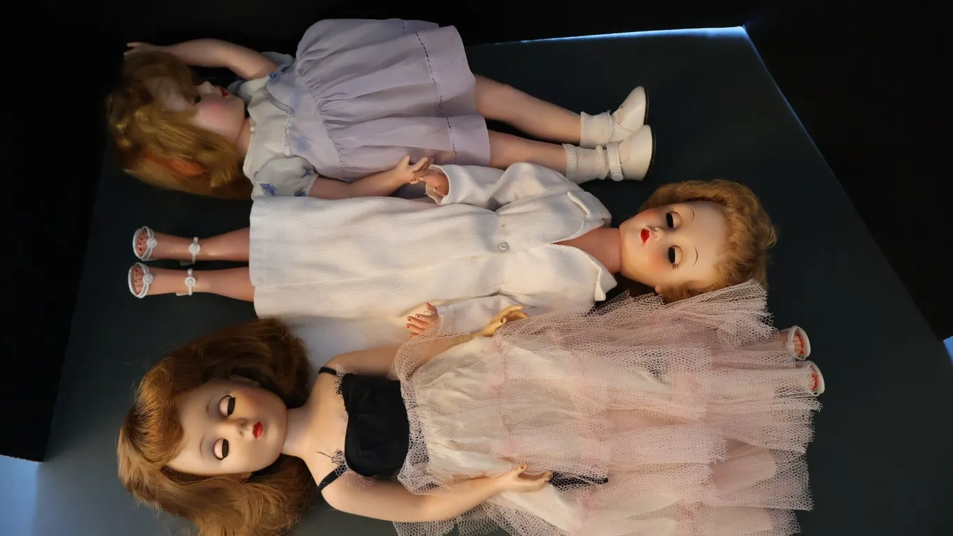 Three Fashion Dolls with Sleep Eyes, Tiered Pink Tulle Gown, White Coat Dress, and Lavender Pinafore
