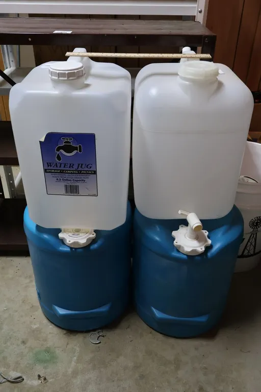 Four Plastic Water Storage Containers