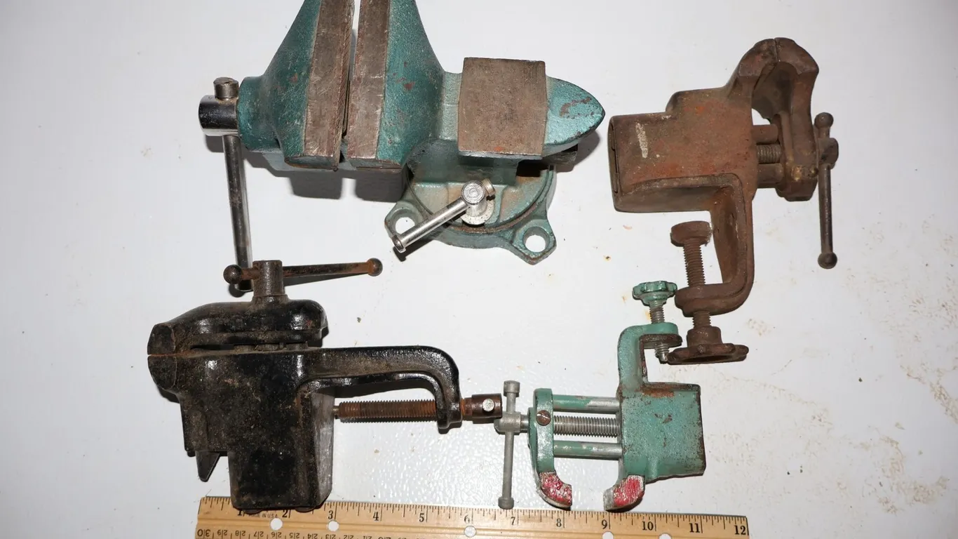 Four Cast Iron Bench and Clamp-On Vises