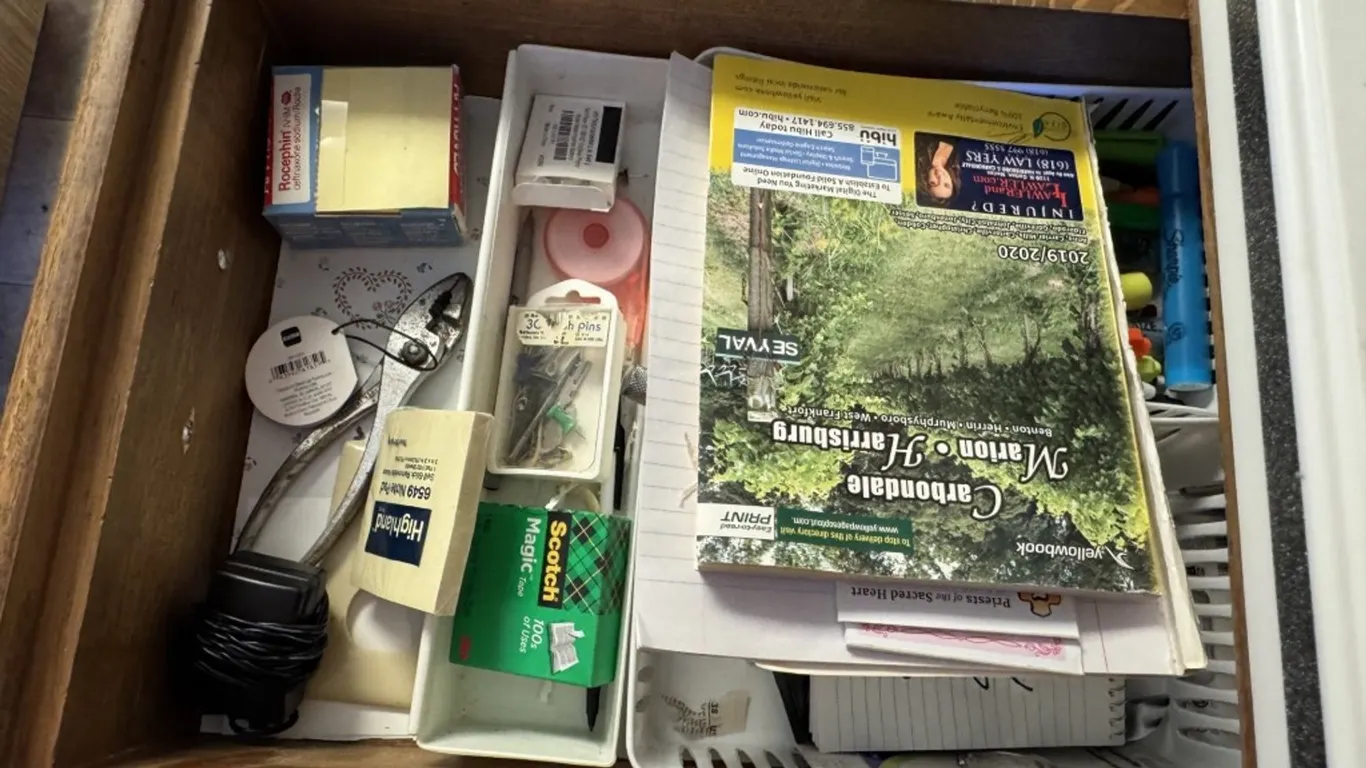 Assorted Drawer Contents: Office Supplies, Hand Tools, Food Storage Bags, and Kitchen Accessories