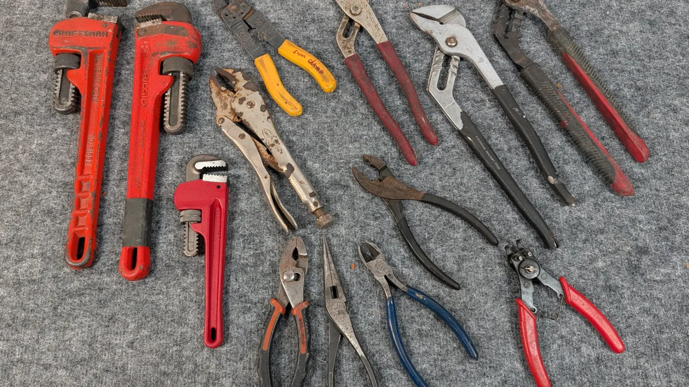 Assorted Hand Tools including Pipe Wrenches, Pliers, and Vise Grips
