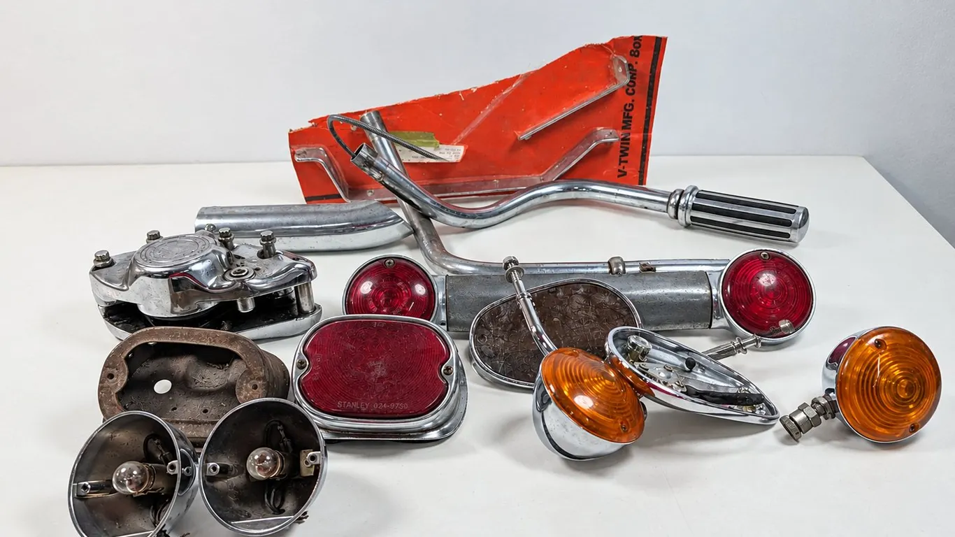 Motorcycle Parts Lot including Taillights, Turn Signals, and Handlebars