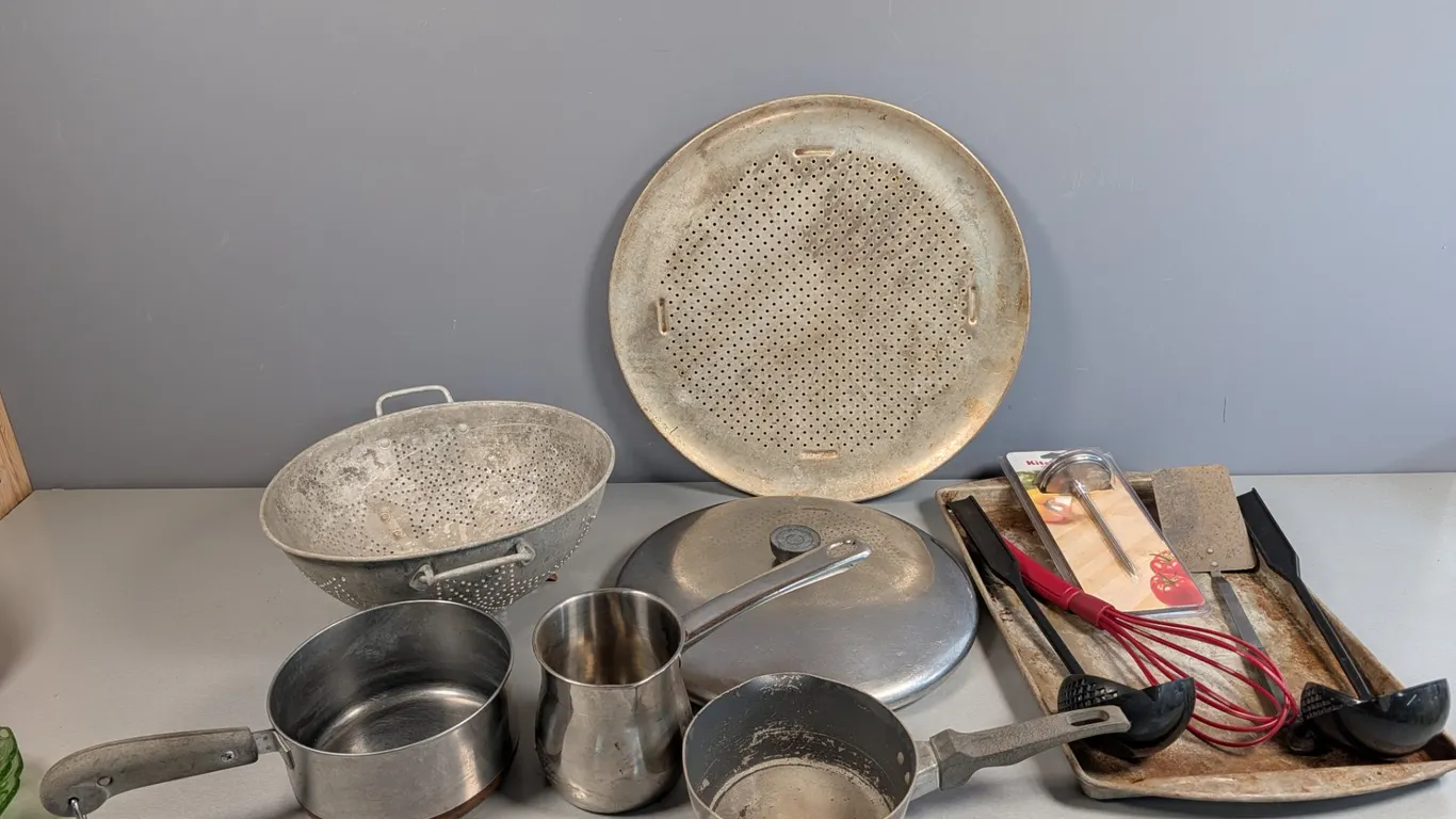 Assorted Vintage Kitchenware Lot with Pans, Colander, and Utensils