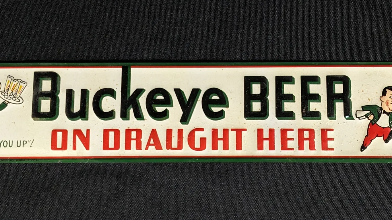 EMBOSSED TIN SIGN BUCKEYE BEER ON DRAUGHT HERE