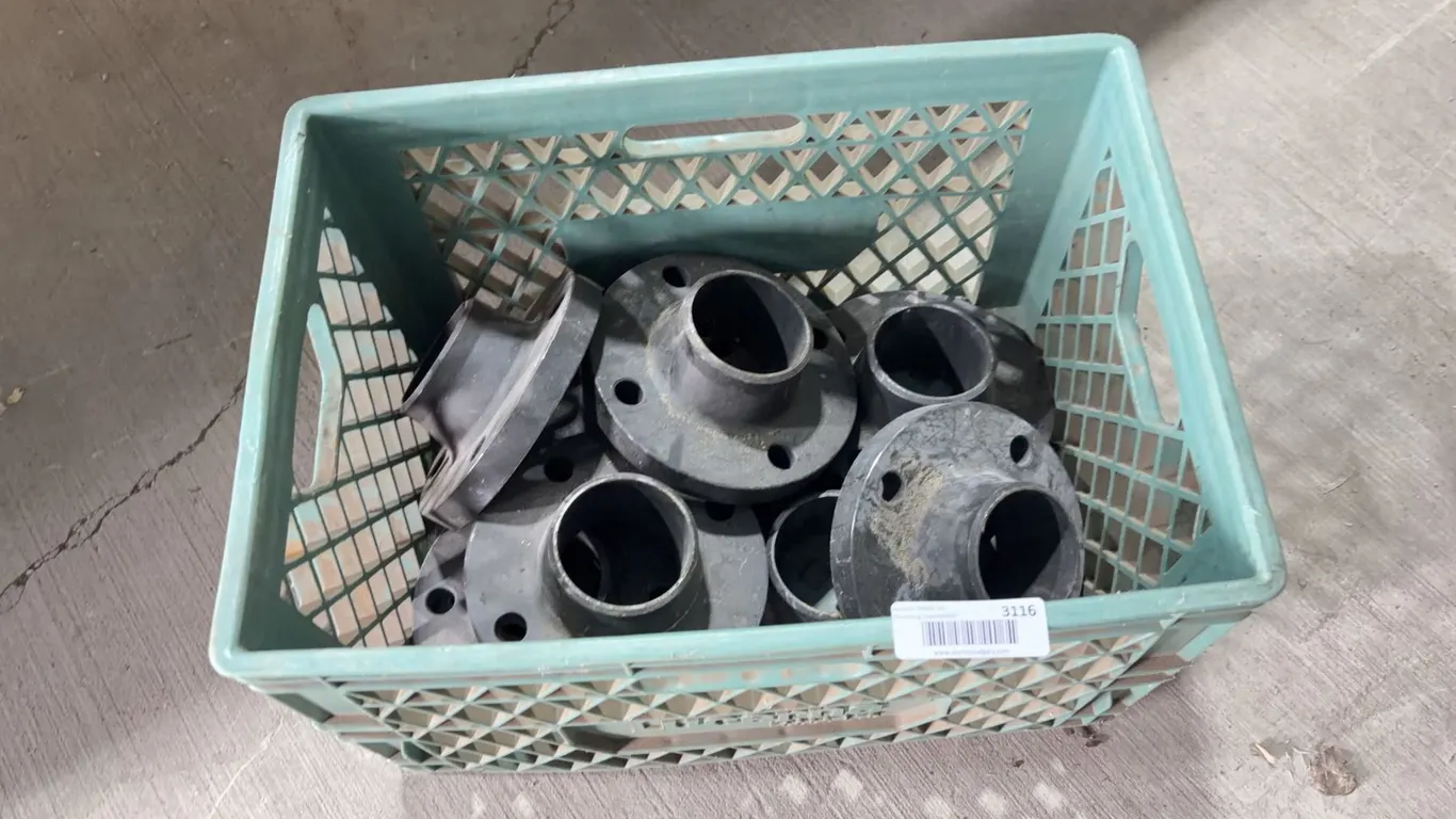 Lot of Metal Pipe Flanges In Plastic Crate