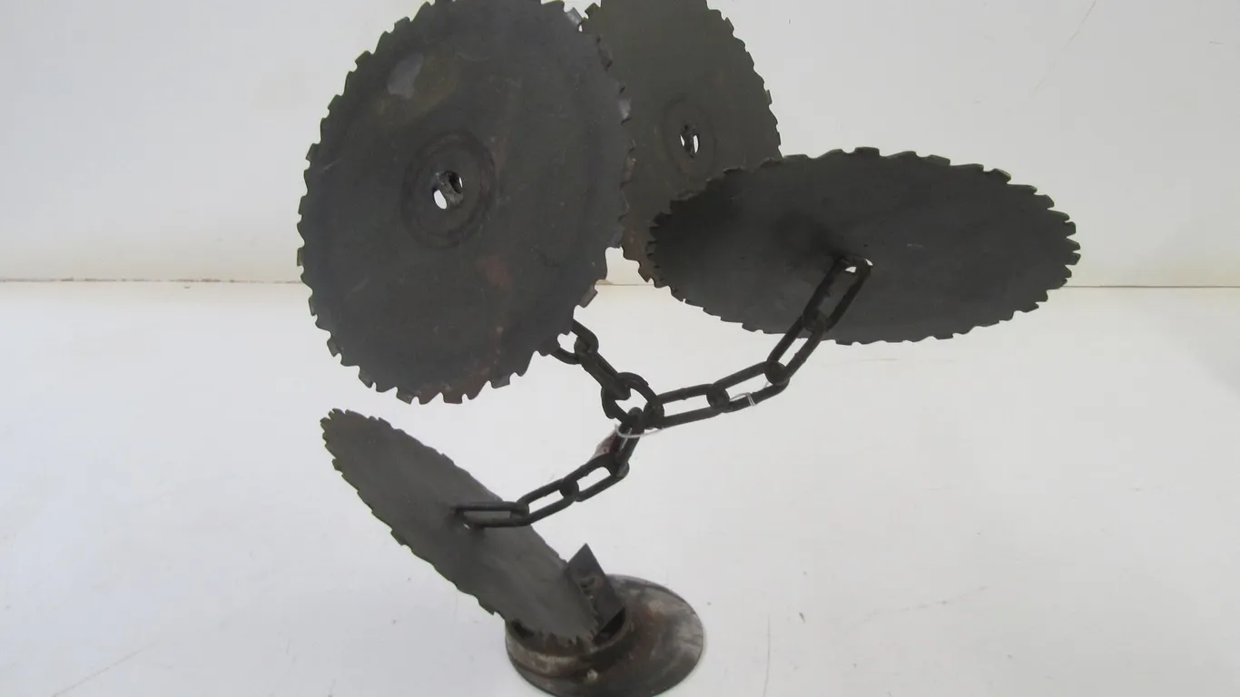 Saw Blade And Chain Metal Artwork By M. Erickson