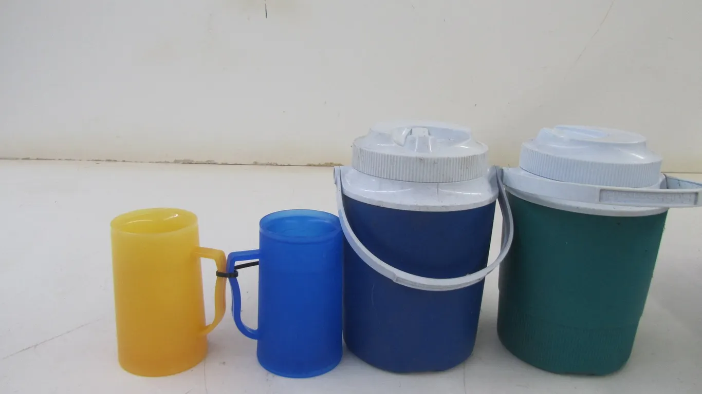 (2) Water Jugs And (2) Freezer Mugs
