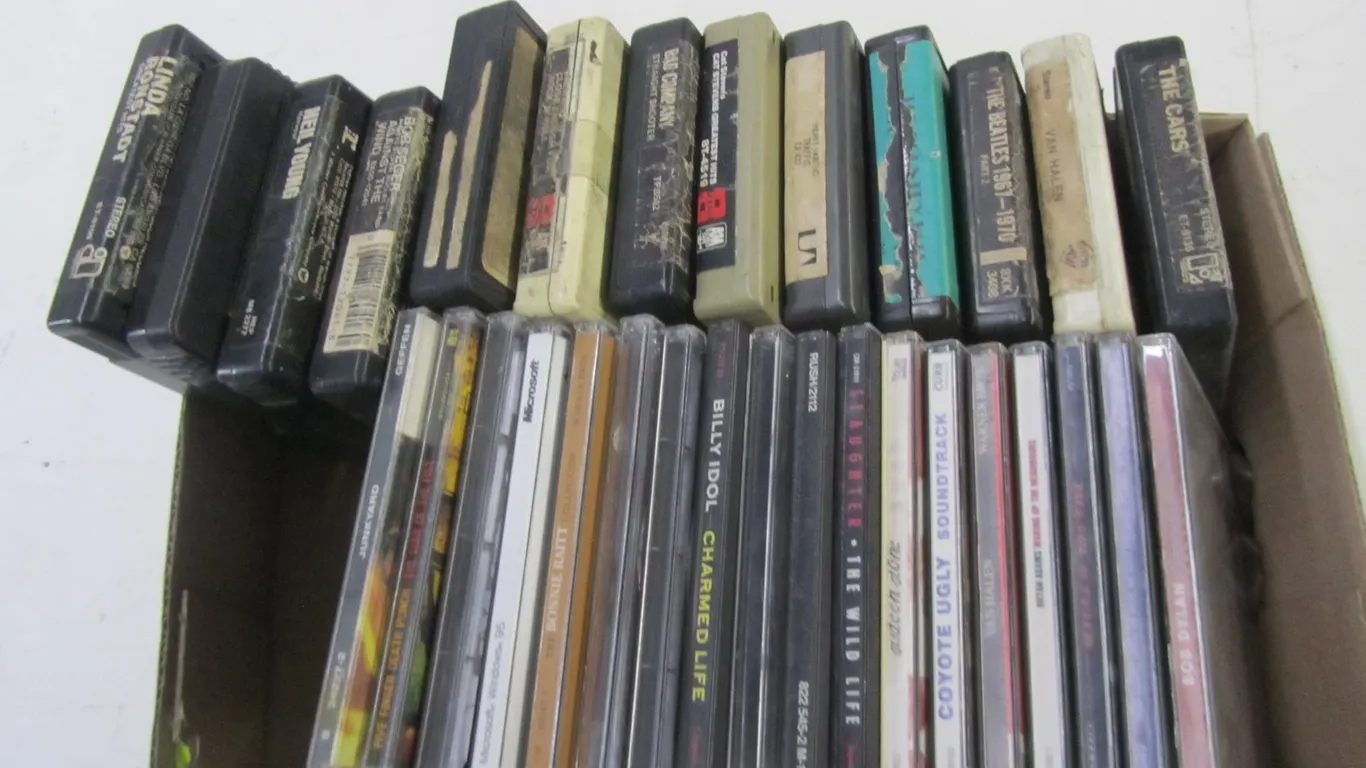(18) Assorted CDs And (13) 8-Track Tapes