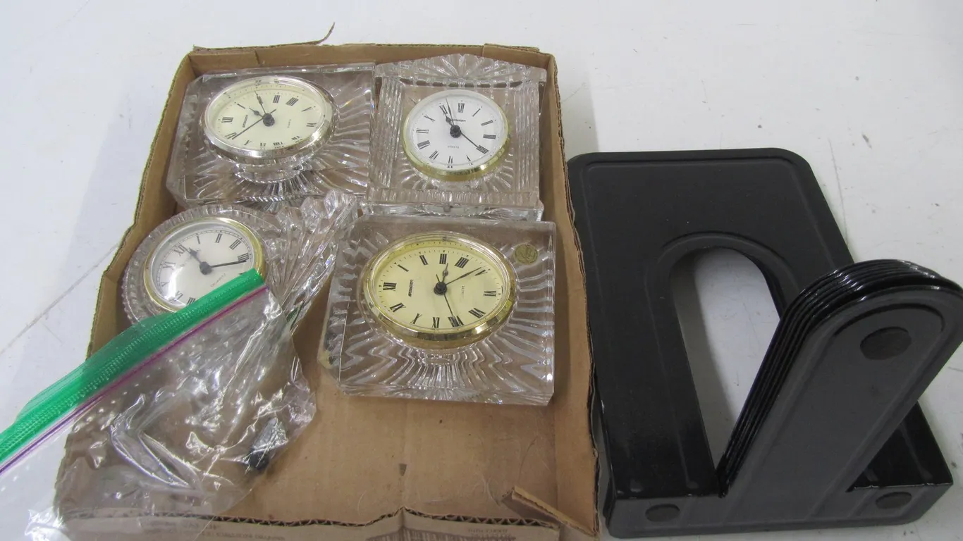 (4) Glass Clocks And (8) Metal Book Ends