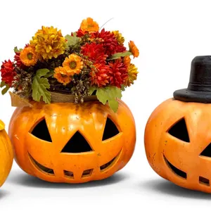 Three Decorative Ceramic Jack-O'-Lanterns with Floral Accent