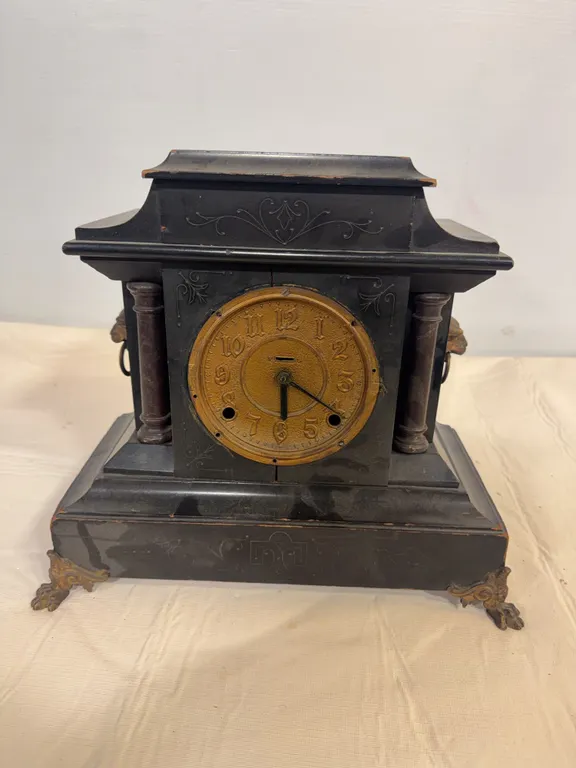 Antique Black Mantel Clock with Ornate Brass-Tone Dial