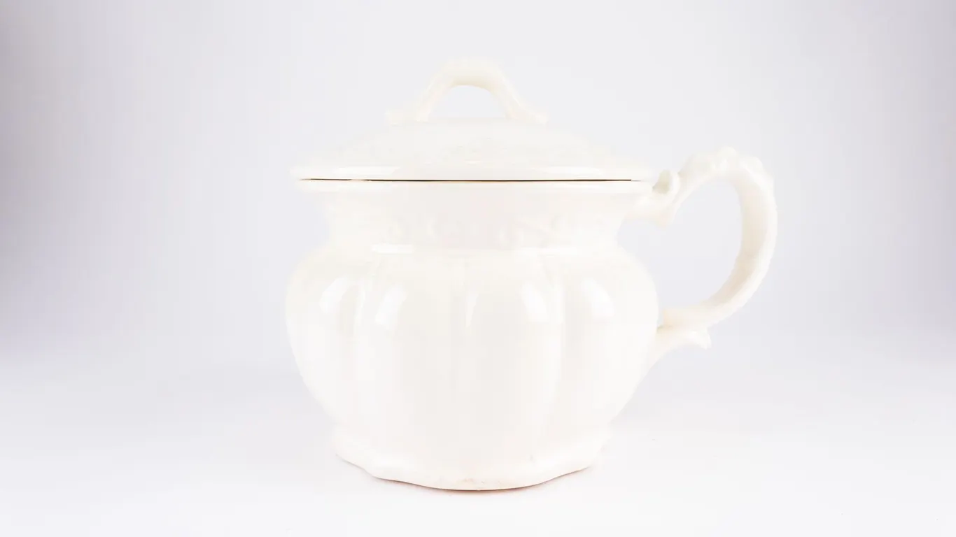 Vintage White Ceramic Covered Chamber Pot with Handle and Raised Scroll Details