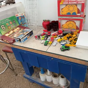 Quantity of miniature toys, several board games, writing pads, wire boot rack, ruby red glasses,