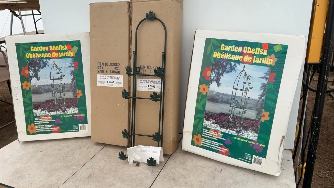 A pair of garden obelisks, a pair of ivy photo frame display racks