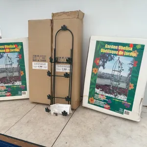 A pair of garden obelisks, a pair of ivy photo frame display racks