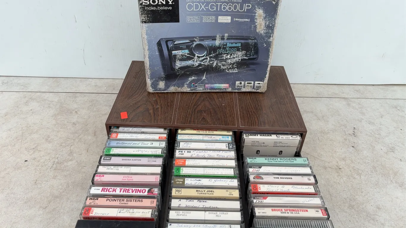 Unused CD radio player, quantity of cassette tapes