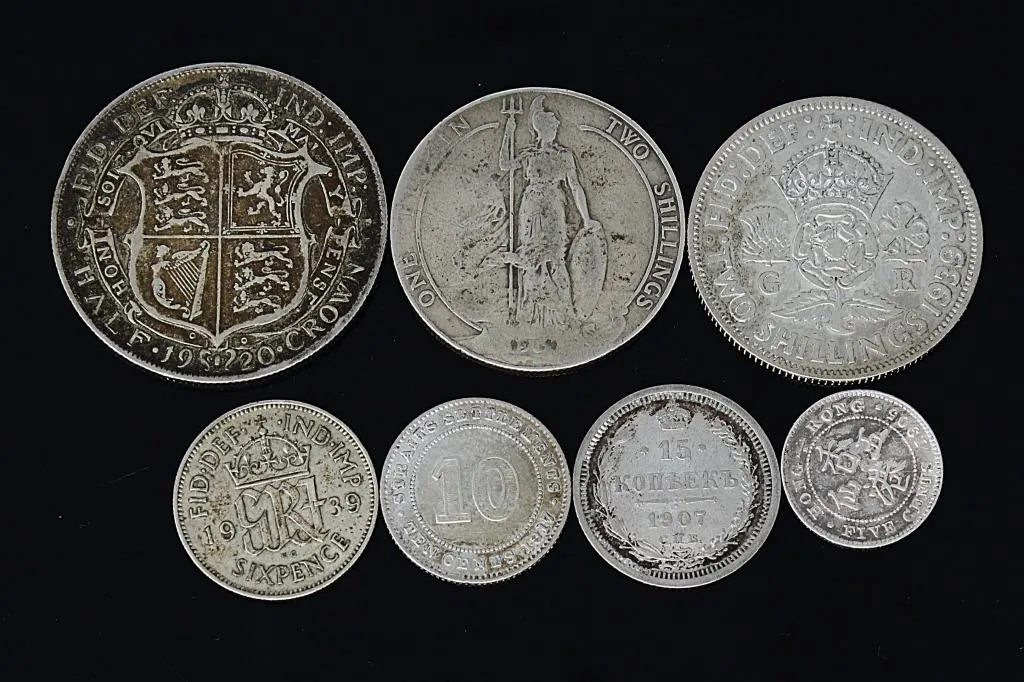 7 ASSTD. INTERNATIONAL SILVER COINS 45.80g