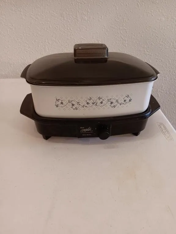 Vintage West Bend slow cooker with pot and lid.