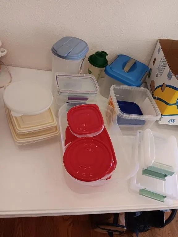 Assortment of plastic containers with lids.