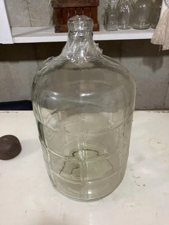 5 gallon glass jug. Used for making wine.
