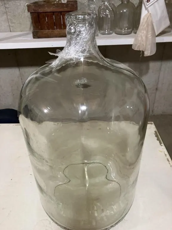 6 gallon glass jug. Used for making wine.