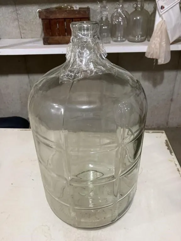 5 gallon glass jug. Used for making wine.
