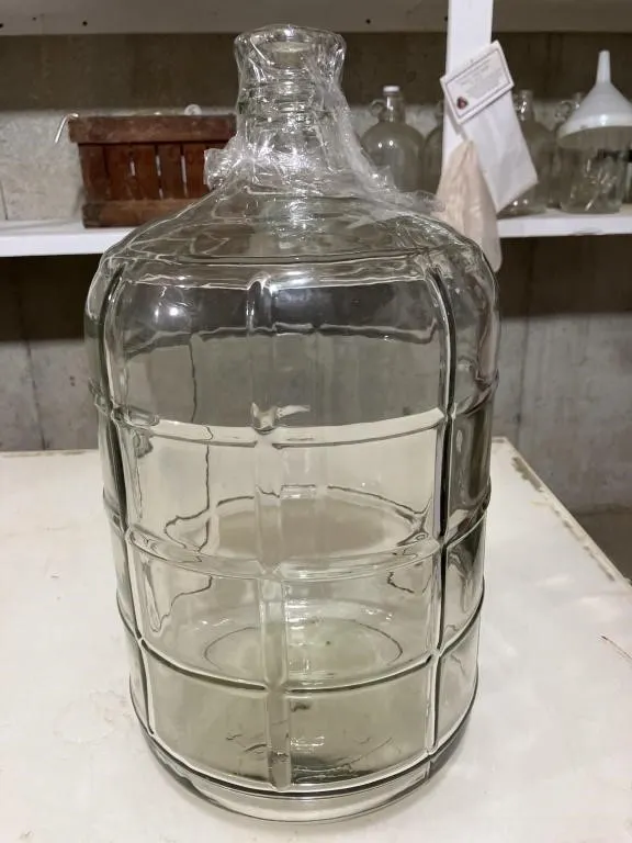 3 gallon glass jug. Used for making wine.