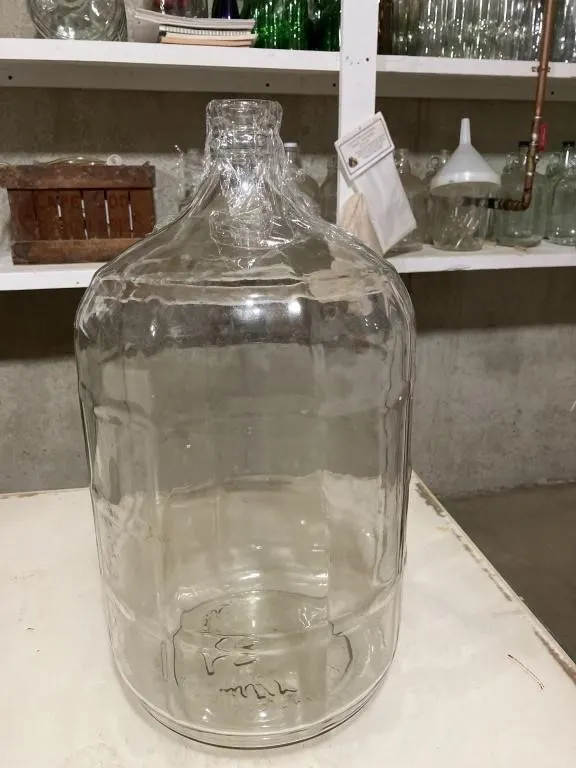 5 gallon glass jug. Used for making wine.