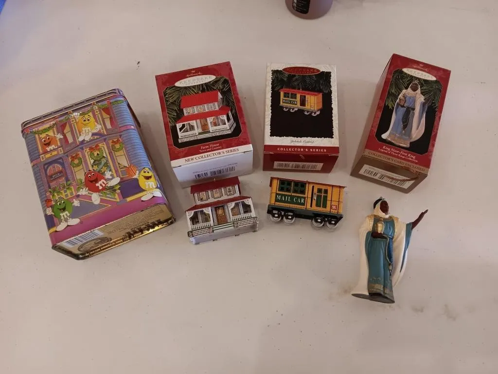Collectors ornaments and M&M tin.